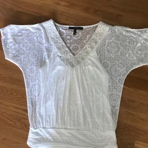 Pretty white top with canoe attached slit arms